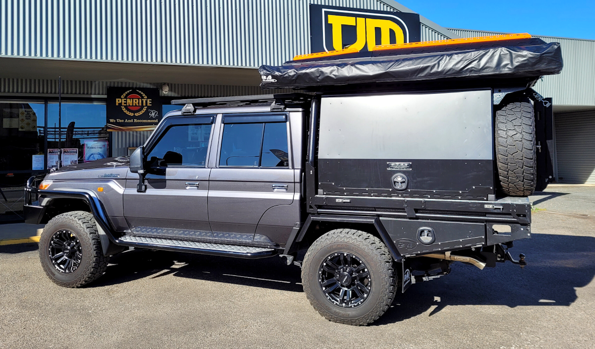 79 series Toyota Landcruiser decked out with Boss Aluminum tray canopy awning and rooftop tent, all Australian made